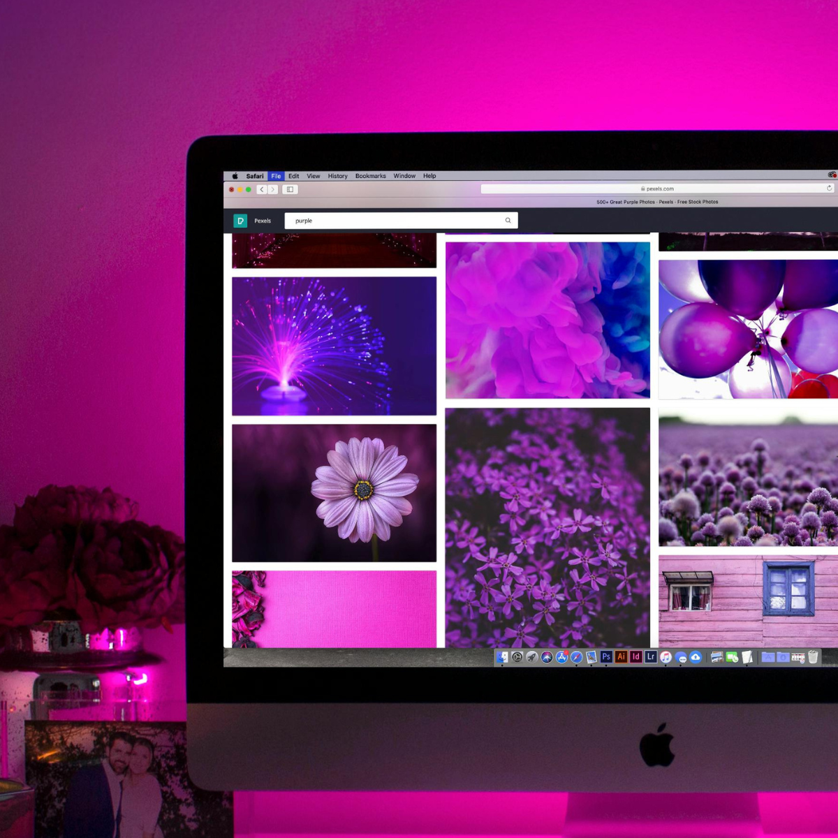 Fuchsia, pink, and purple themed photo of a computer screen showing lots of stock photos.